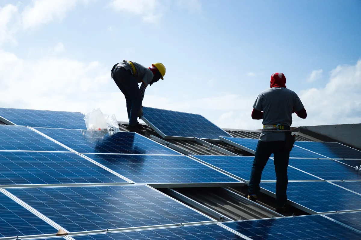 solar panel electric specialists troubleshooting a solar panel system