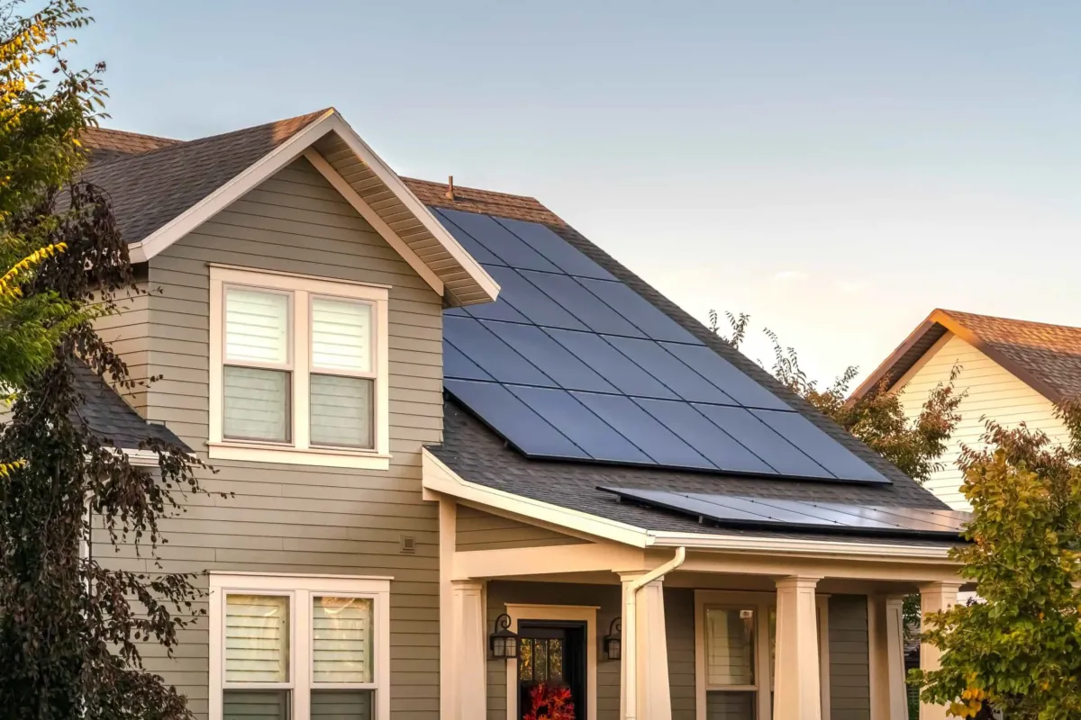 Solar panels installed by Ask Solar Mike on a modern Payson, Utah home, featuring a sleek rooftop system against a backdrop of Mt. Nebo, maximizing energy savings.