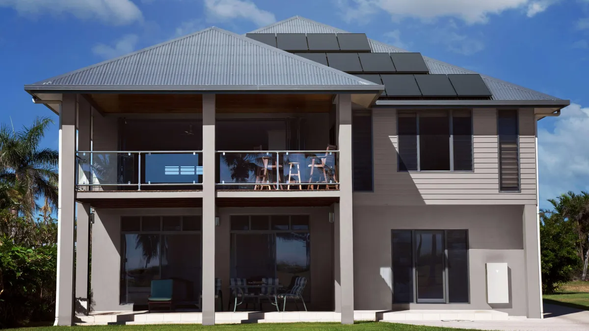Lehi UT home with newly installed Tesla Powerwall 3 battery system on garage wall, connected to solar panels, showcasing net metering optimization and installation secrets for Lehi Power customers