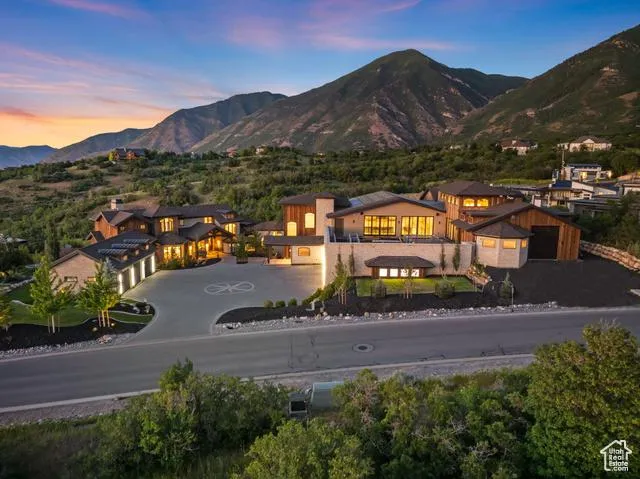 Woodland Hills Utah home before and after EG4 PowerPro ESS battery retrofit, showing solar panels and SESD grid connection for maximized energy savings.