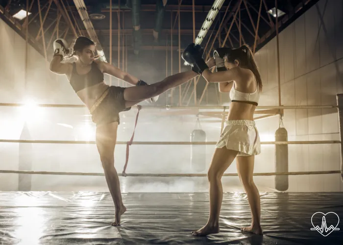 women kickboxing to burn fat