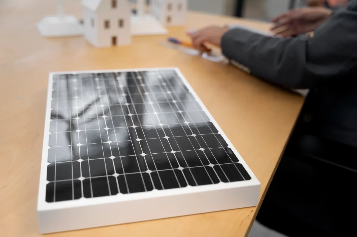 A small solar panel for residential use being used as an example in a meeting