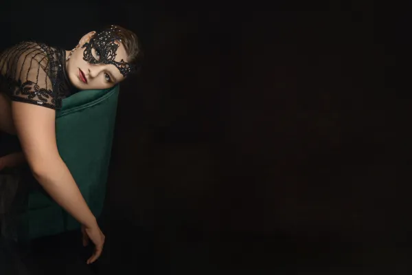 young woman resting her head against the back of a chair