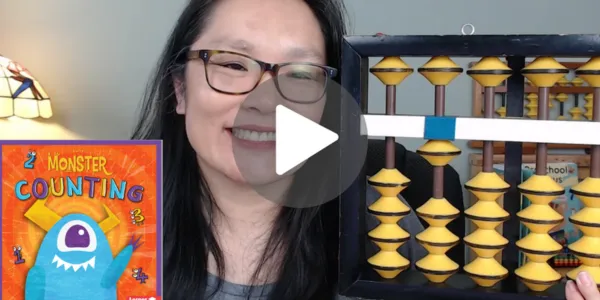 Lynette Yung holding an abacus with a thumbnail of Counting Monsters book