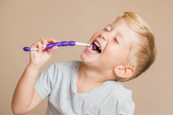 child brushing teeth
