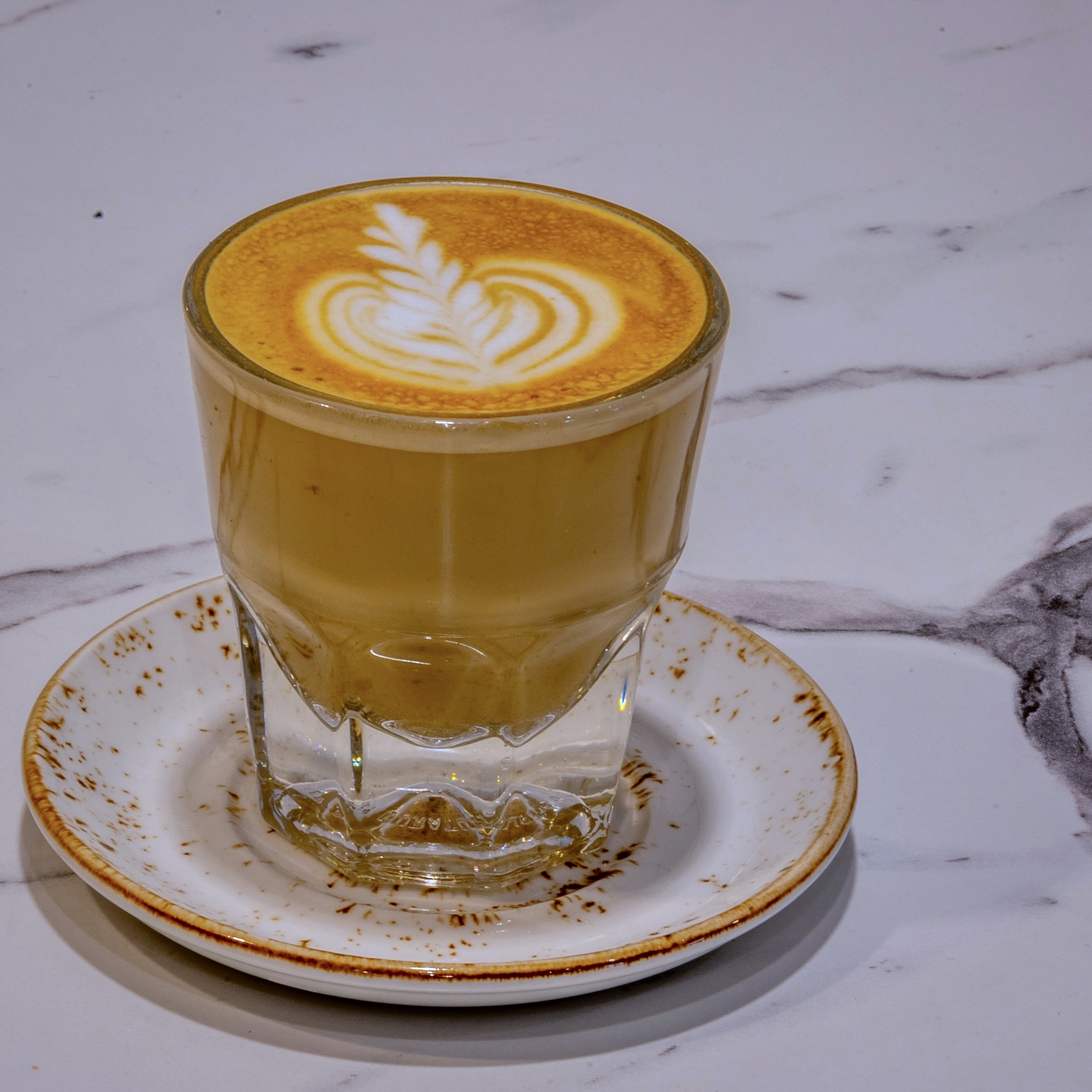 Artisan espresso shot in glass cup at The Aussie Grind Provisions coffee bar