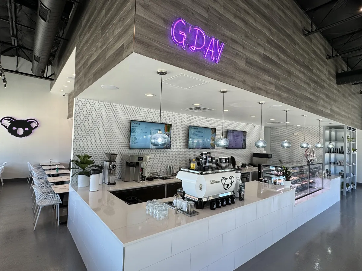 Modern coffee bar interior at The Aussie Grind Provisions in Farmers Branch, Texas