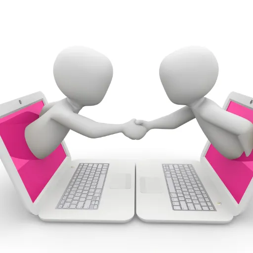 two computers facing each other with cartoons emerging from the screens shaking hands