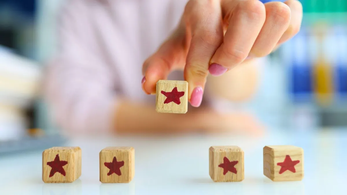 five star blocks hand placing third one