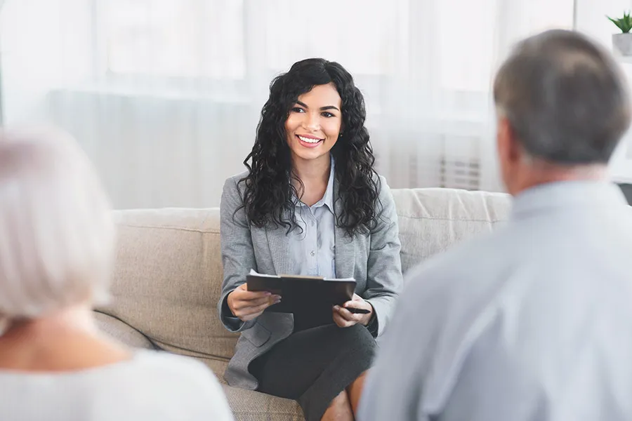 credit counselor talking to older couple