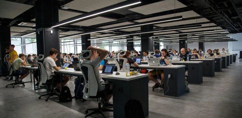 People working busily in an office environment.