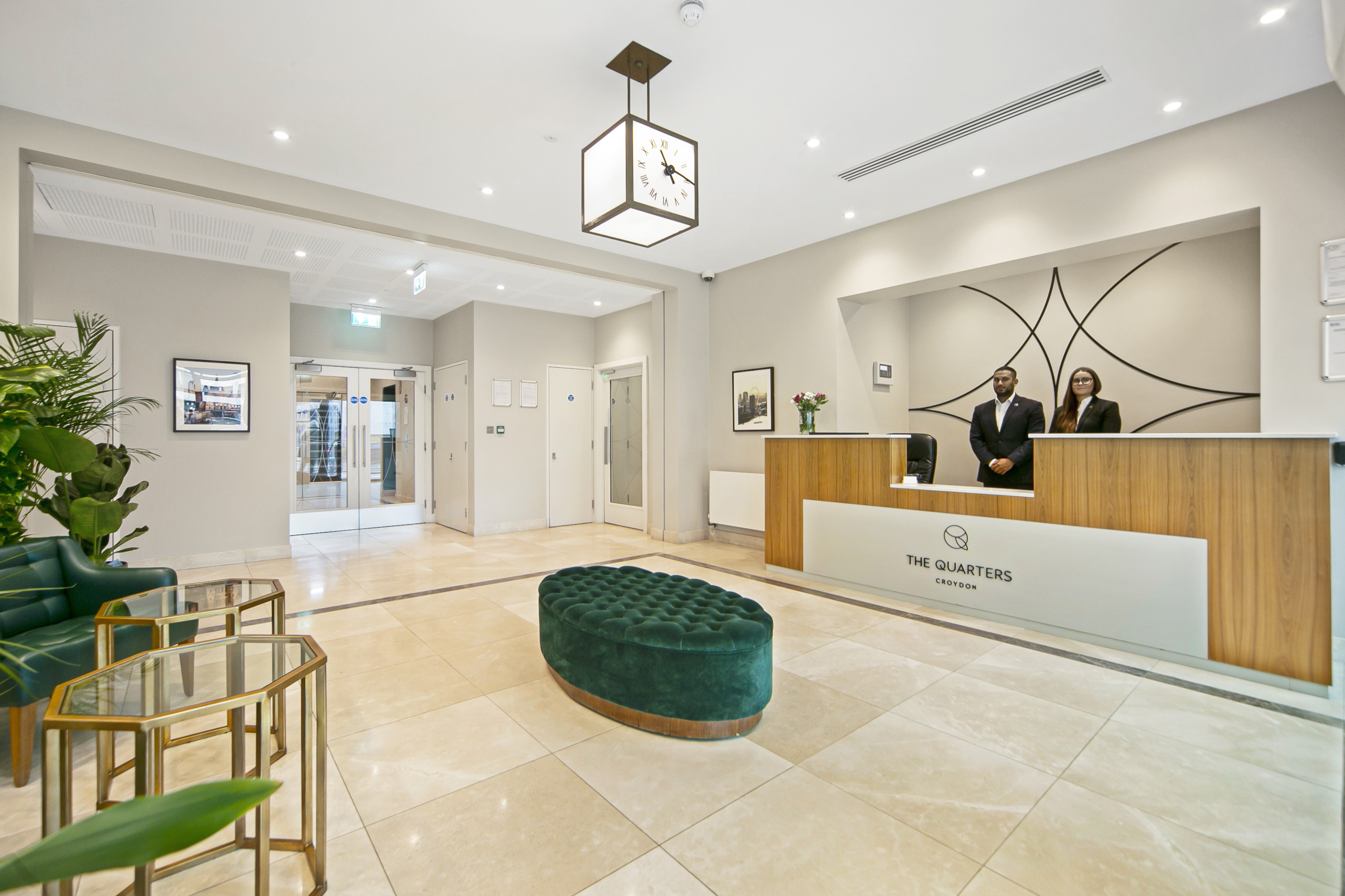 Hotel reception area with front desk and modern interior design