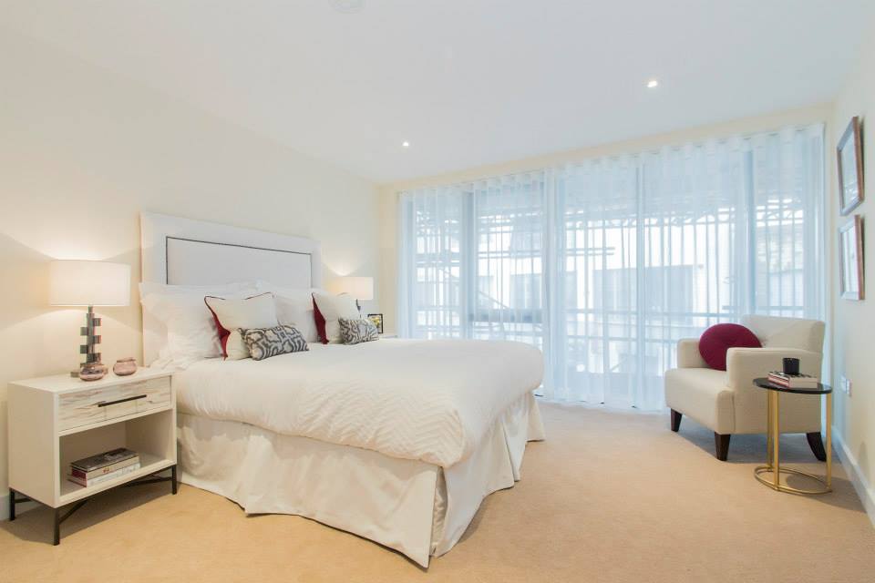 Luxury hotel bedroom with king-size bed and soft neutral interior design