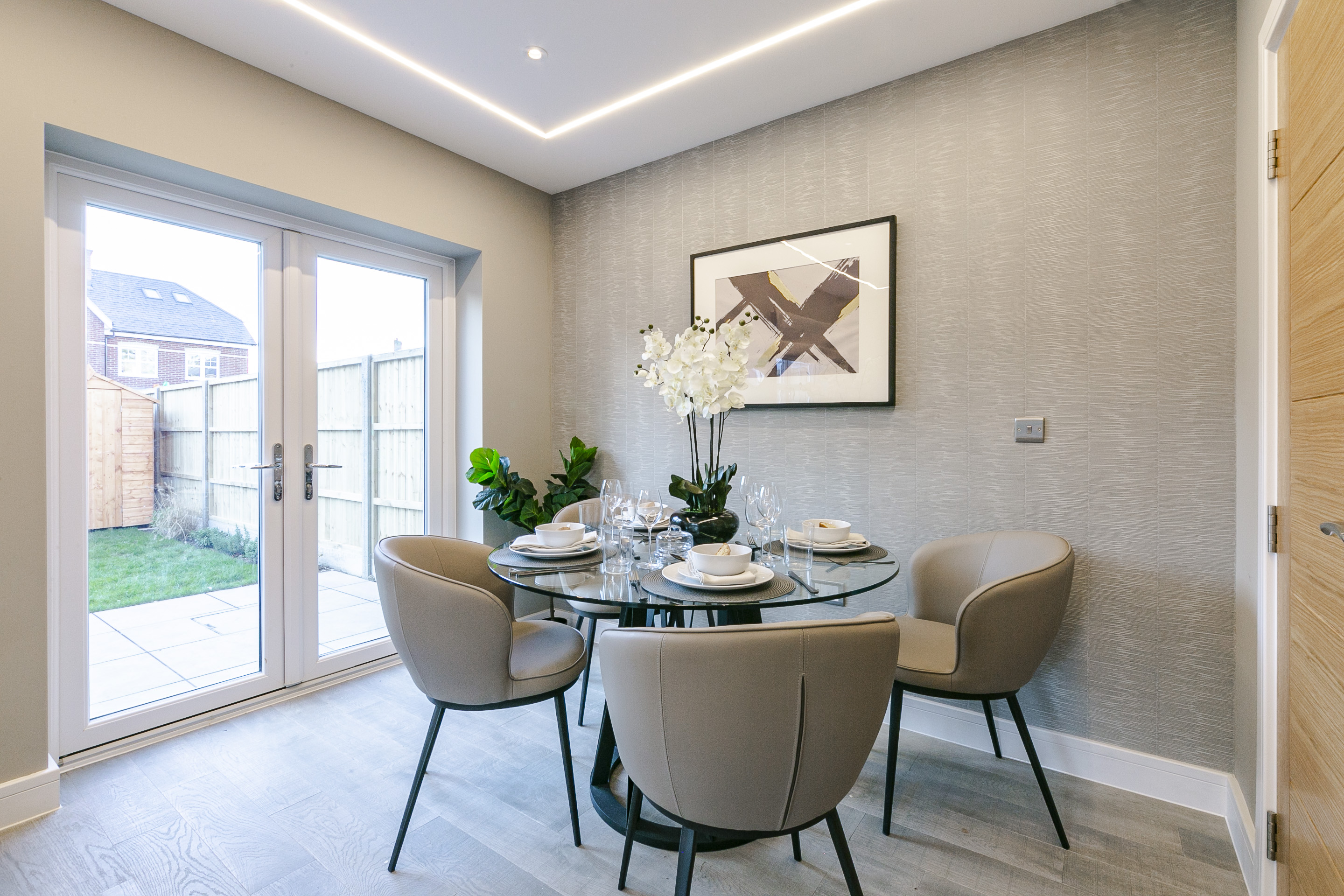 Dining area photographed for a London property listing with garden access