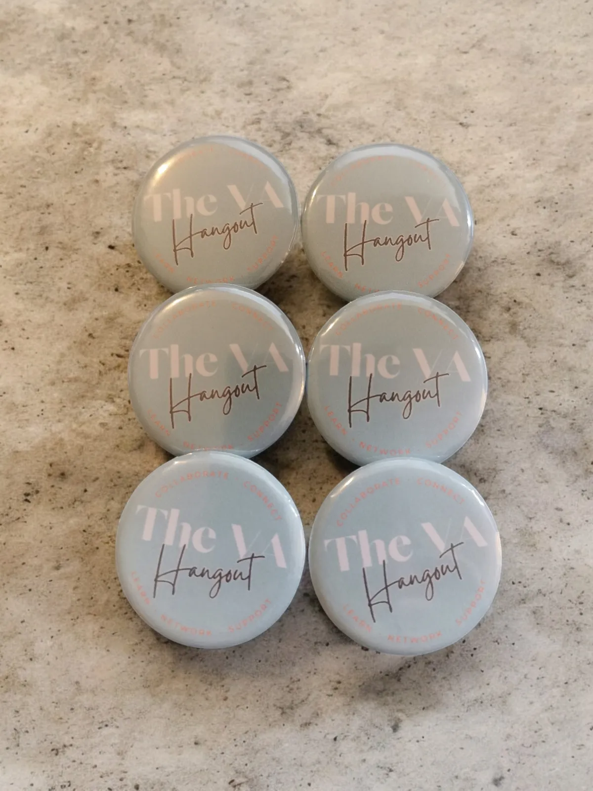 Six round blue badges with the text "The VA Hangout."