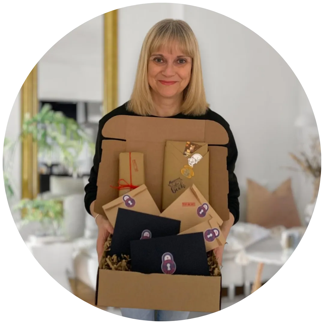 A woman holding a box filled with wrapped items and packages featuring a lock logo.