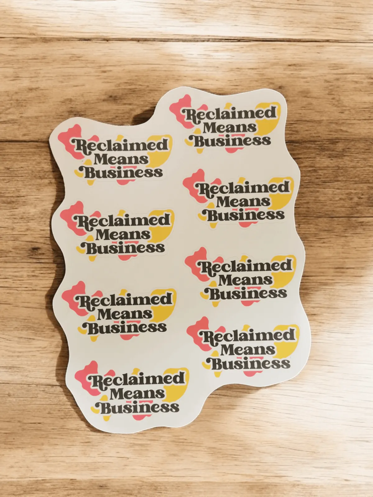 Sheet of branded stickers with the words Reclaimed Means Business on the front