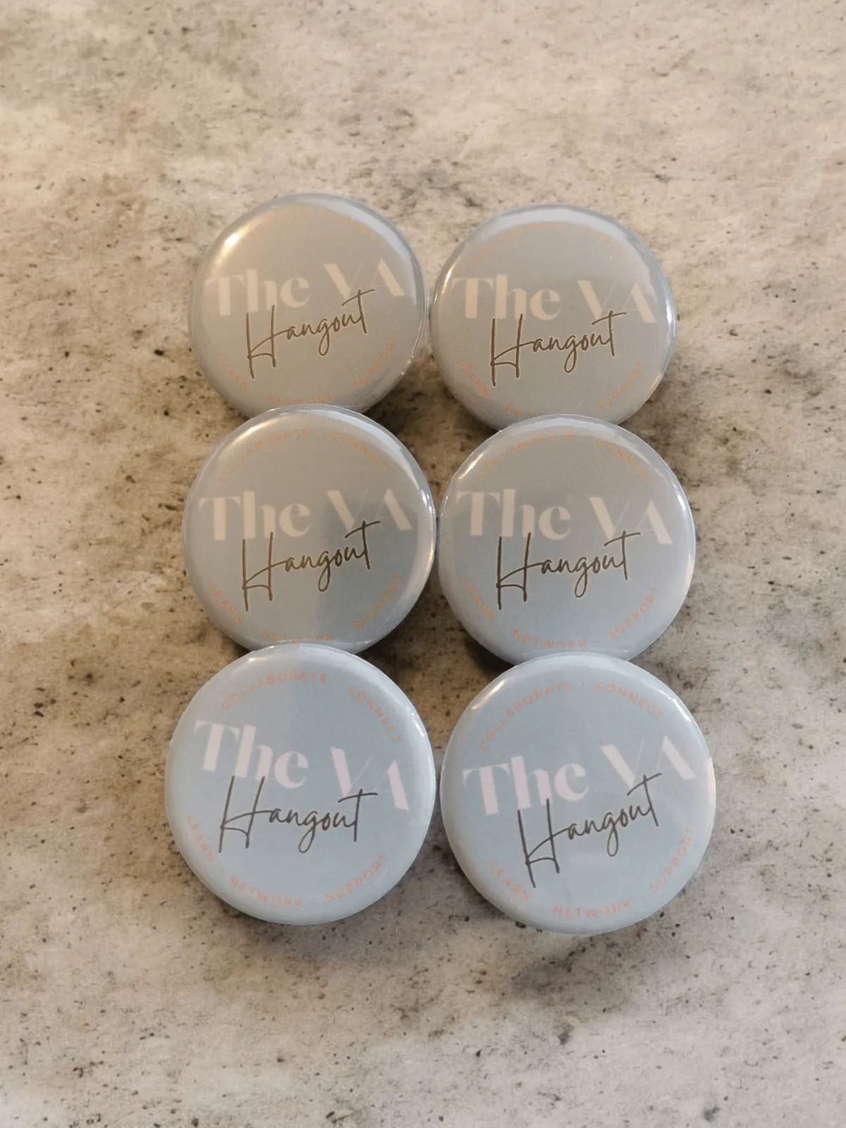 Six round blue badges with the text "The VA Hangout."
