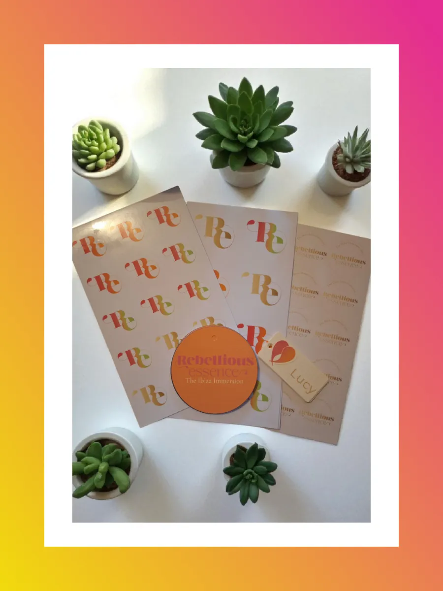 Sheets of branded sticker paper and orange round gift tags