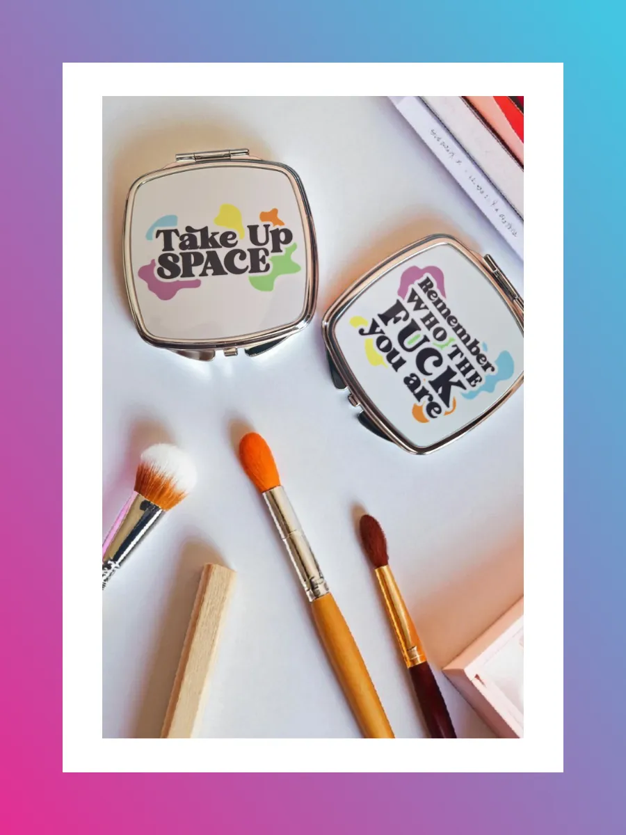 Two branded compact mirrors with Take Up Space and Remember Who You Are