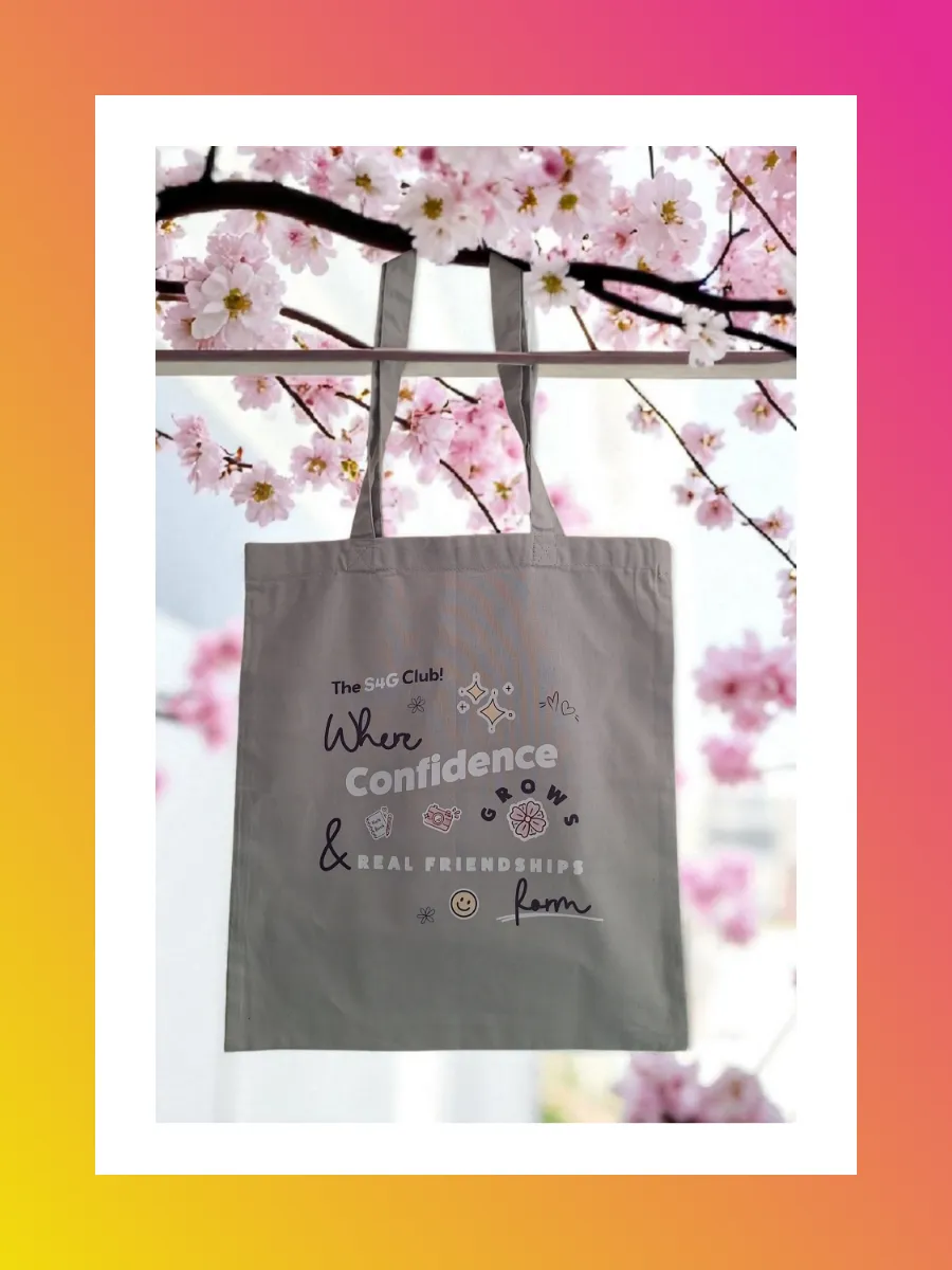 Grey branded tote bag in a blossom tree