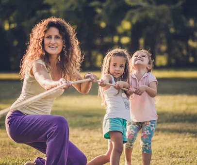 woman and children pulling rope
