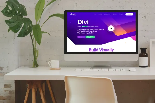 desk with pc with the divi theme on screen