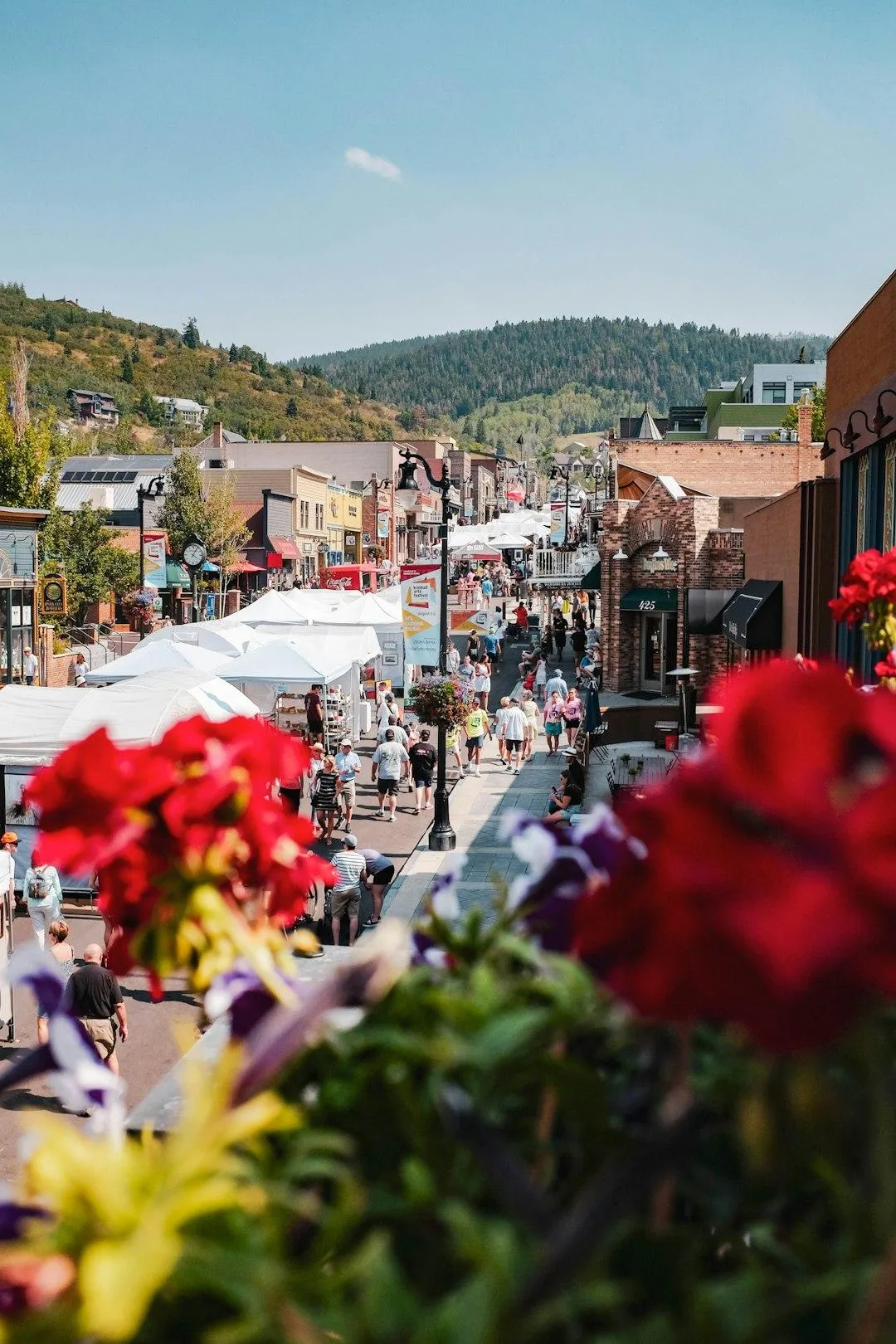 Main Street with local shops and small businesses, symbolizing community-driven enterprises using automation and AI to compete with large corporations.