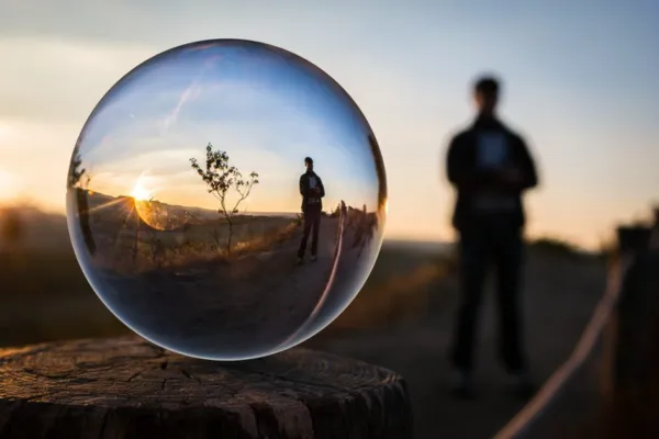 Man standing on a road with a bubble