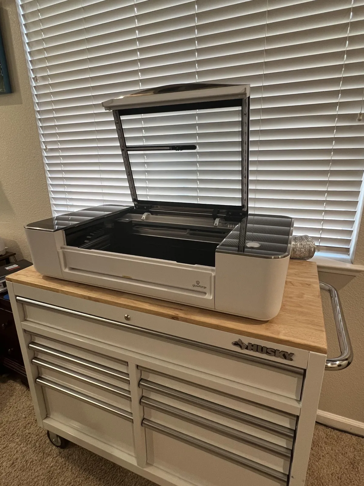 Glowforge on a crafting cabinet in a craft room