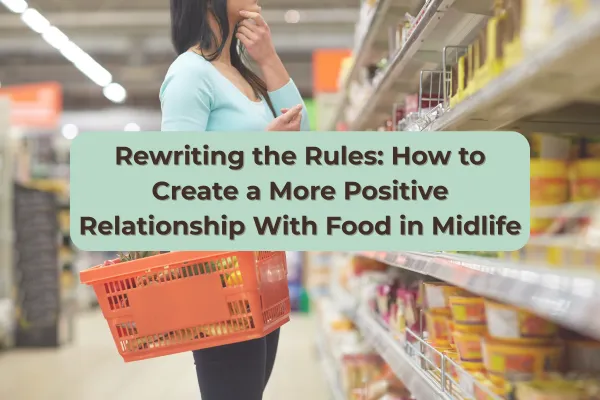 Midlife woman in a grocery store holding a shopping basket, thoughtfully looking at food on the shelves, symbolising mindful eating and food choices