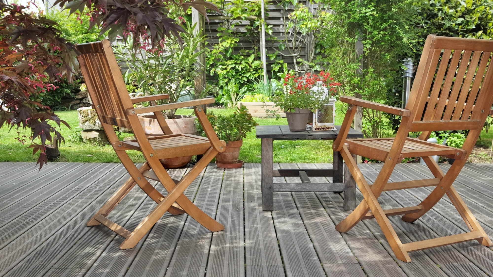 Eco-modern wildlife garden in Carshalton with seating deck, timber furniture and wildlife-friendly planting