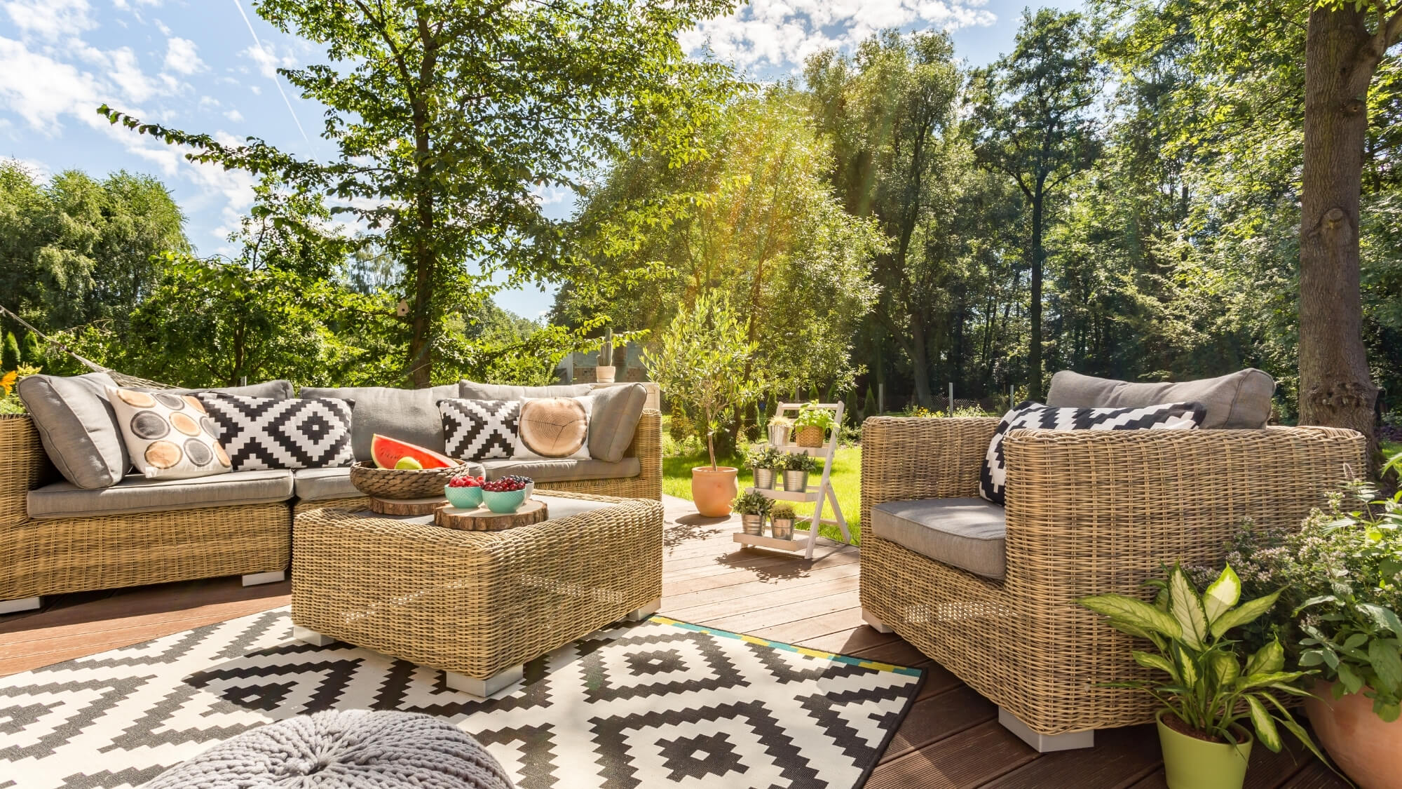 Modern family garden in Wallington, Surrey with outdoor seating, natural materials and eco-friendly planting