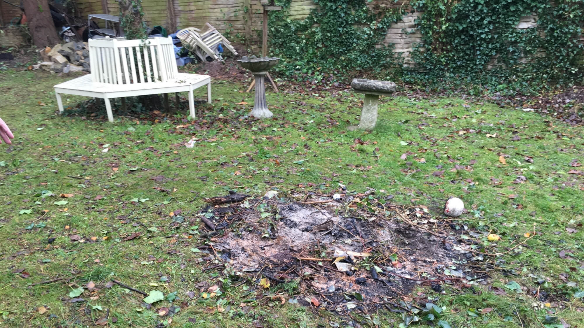 Before: overgrown lawn and worn garden area in Carshalton prior to landscaping by EarthCare Gardens