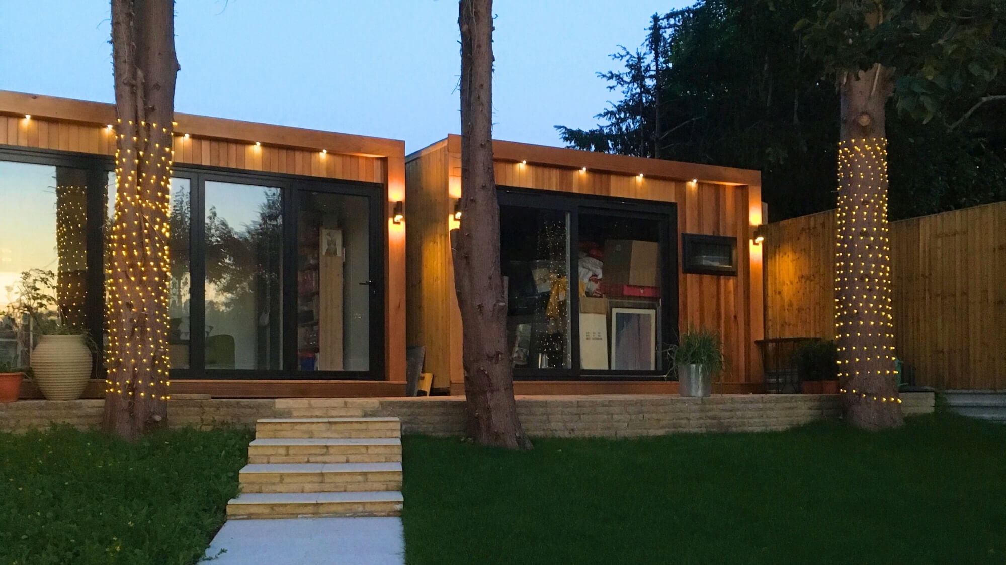 Contemporary cedar-clad garden room with full glazing, designed and built by EarthCare Gardens in South London