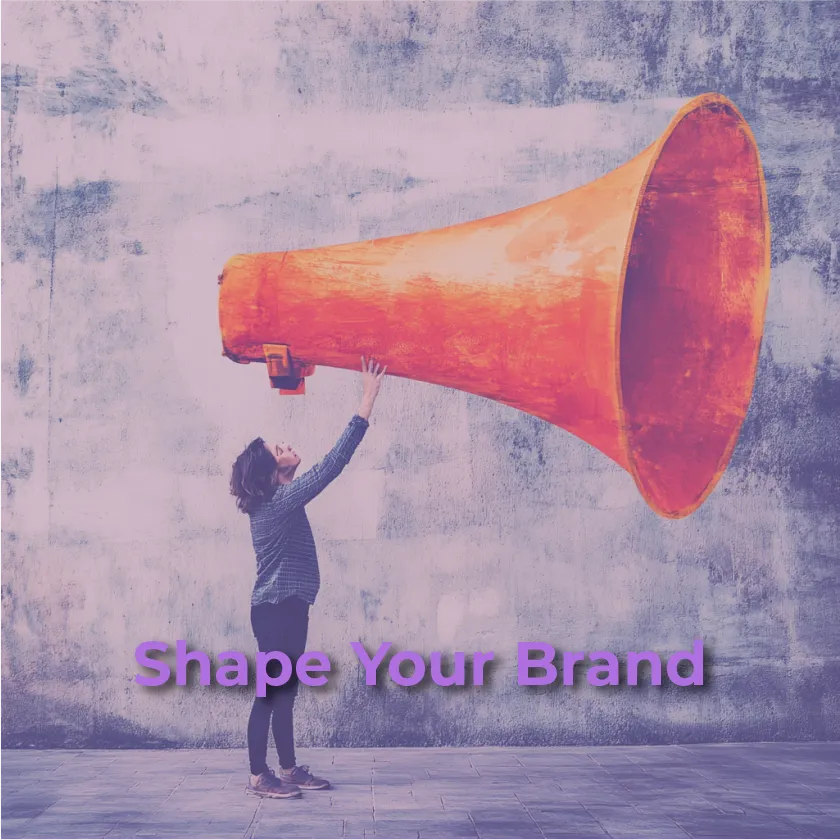 A person in a dark shirt and pants reaches up towards a massive, faded orange megaphone that is suspended in the air. The background is a textured, light grey wall. The text "Shape Your Brand" is in purple at the bottom.