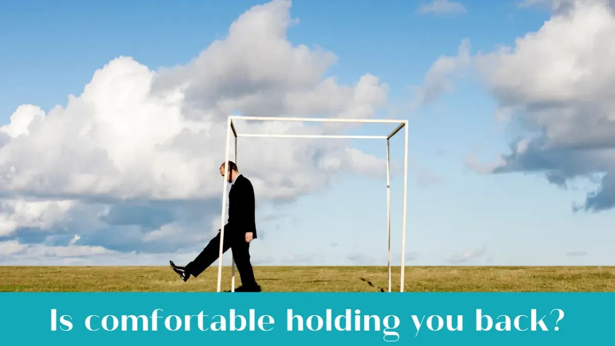 Bookkeeper working early morning at desk, symbolising stepping outside comfort zone for growth