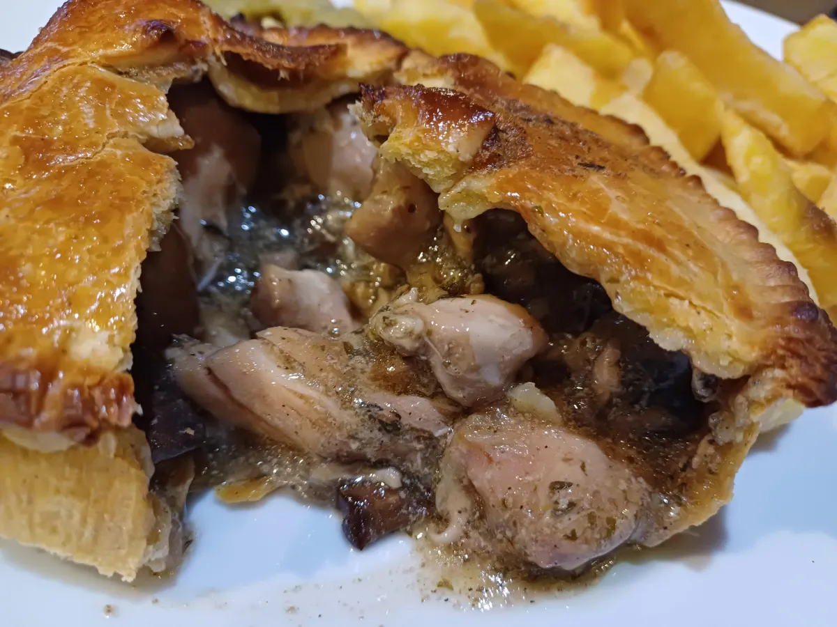 A pie cut open showing the filling