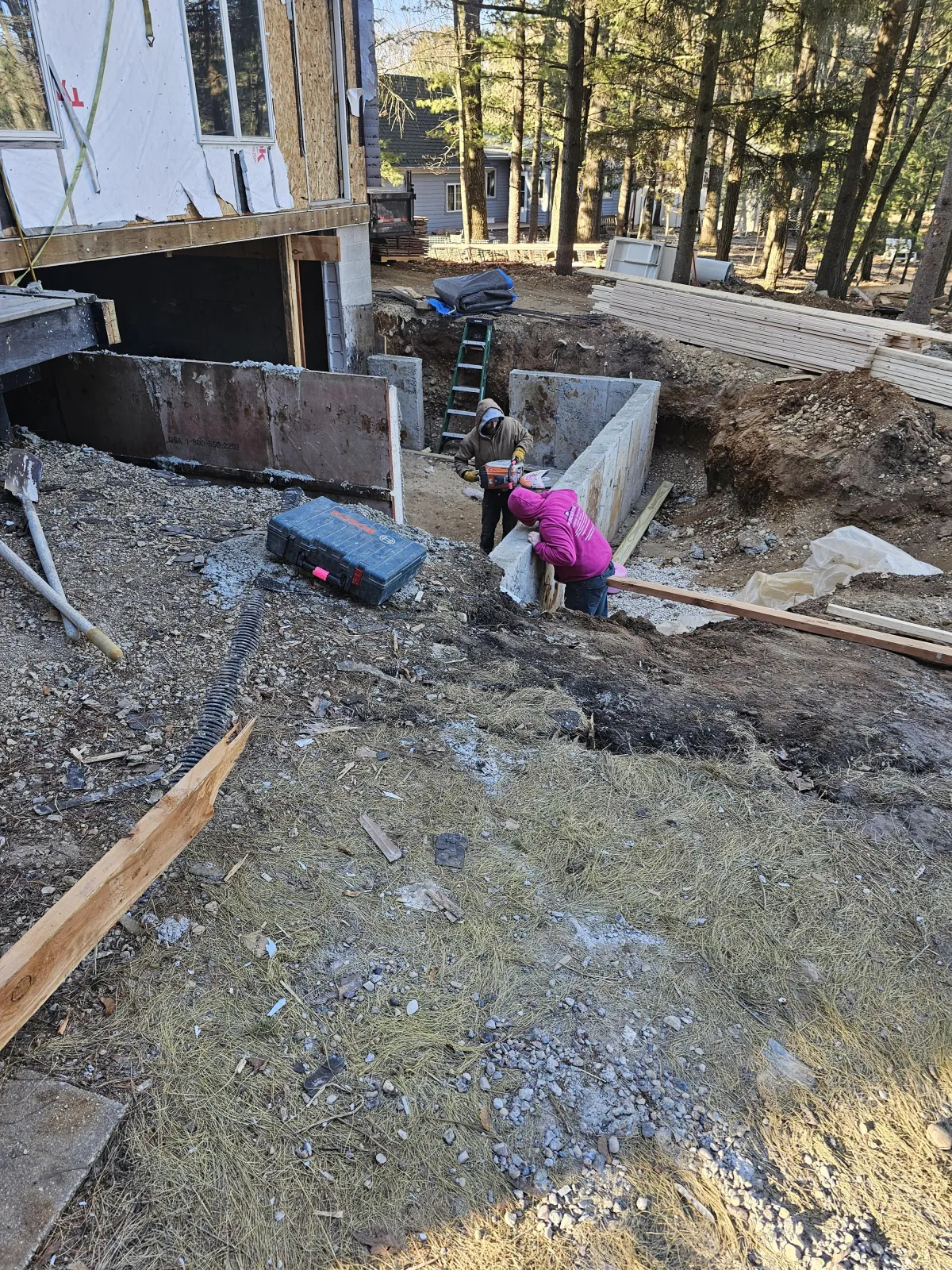 cleaning off the foundation walls and making sure everything is squared up for the framing!