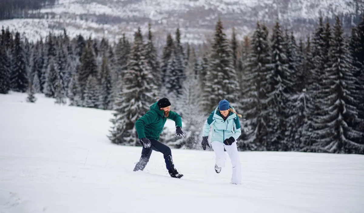 couple running in snow