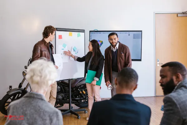 Professional presenting ideas to an audience with digital ripple effects symbolizing thought leadership.