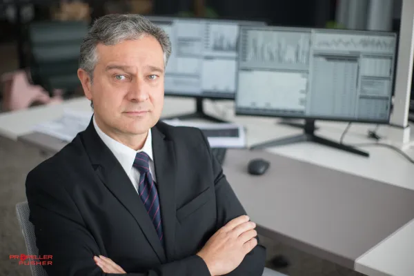 Man looking serious in a modern office setting.