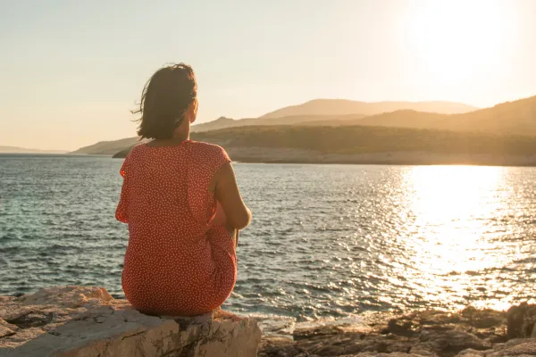 Professional taking a mindful pause from work, reflecting in a calm environment to realign with career clarity and intention.