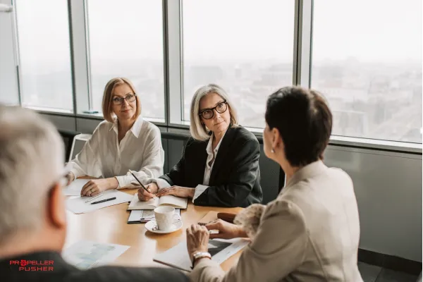 Business leader speaking calmly with a colleague in a one-on-one meeting