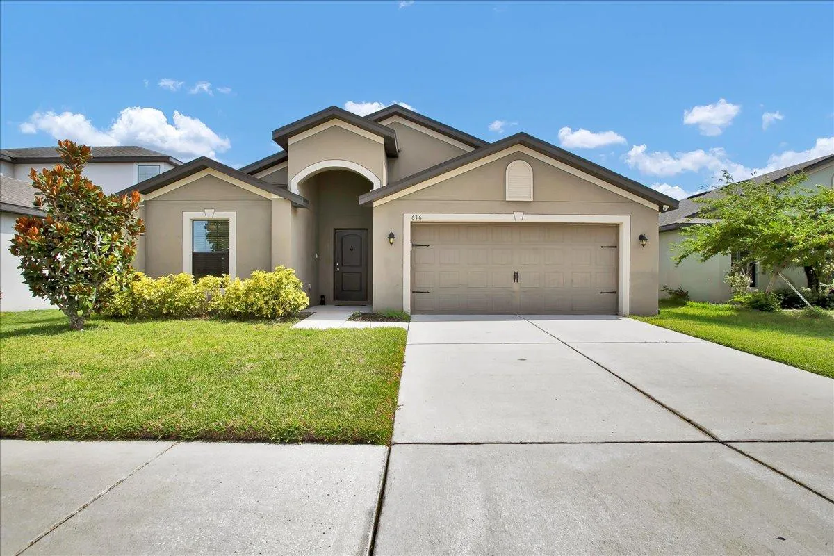 Front view of 616 Chatham Walk Dr Ruskin FL home for sale with solar panels