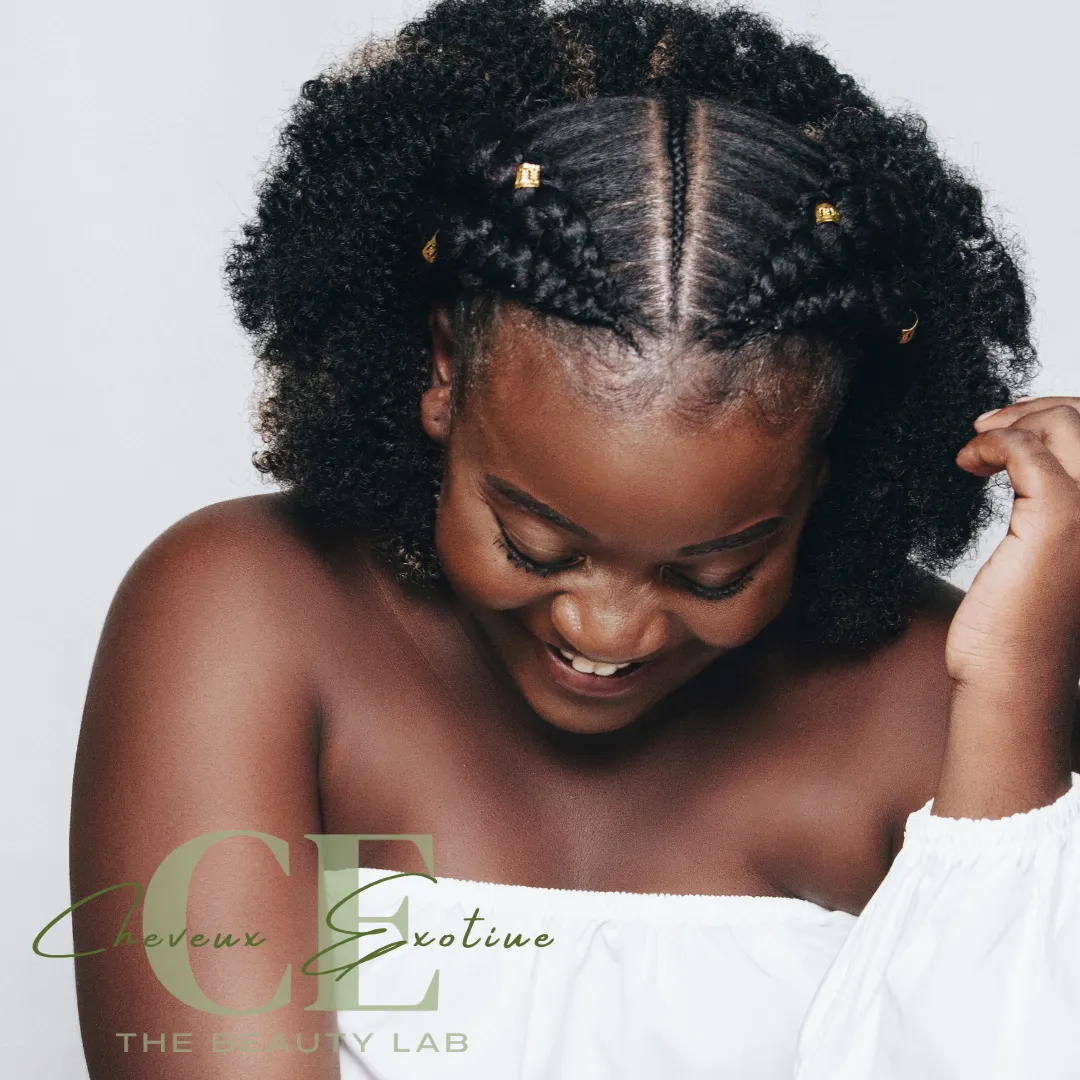 African  American young woman wearing two braids with an afro