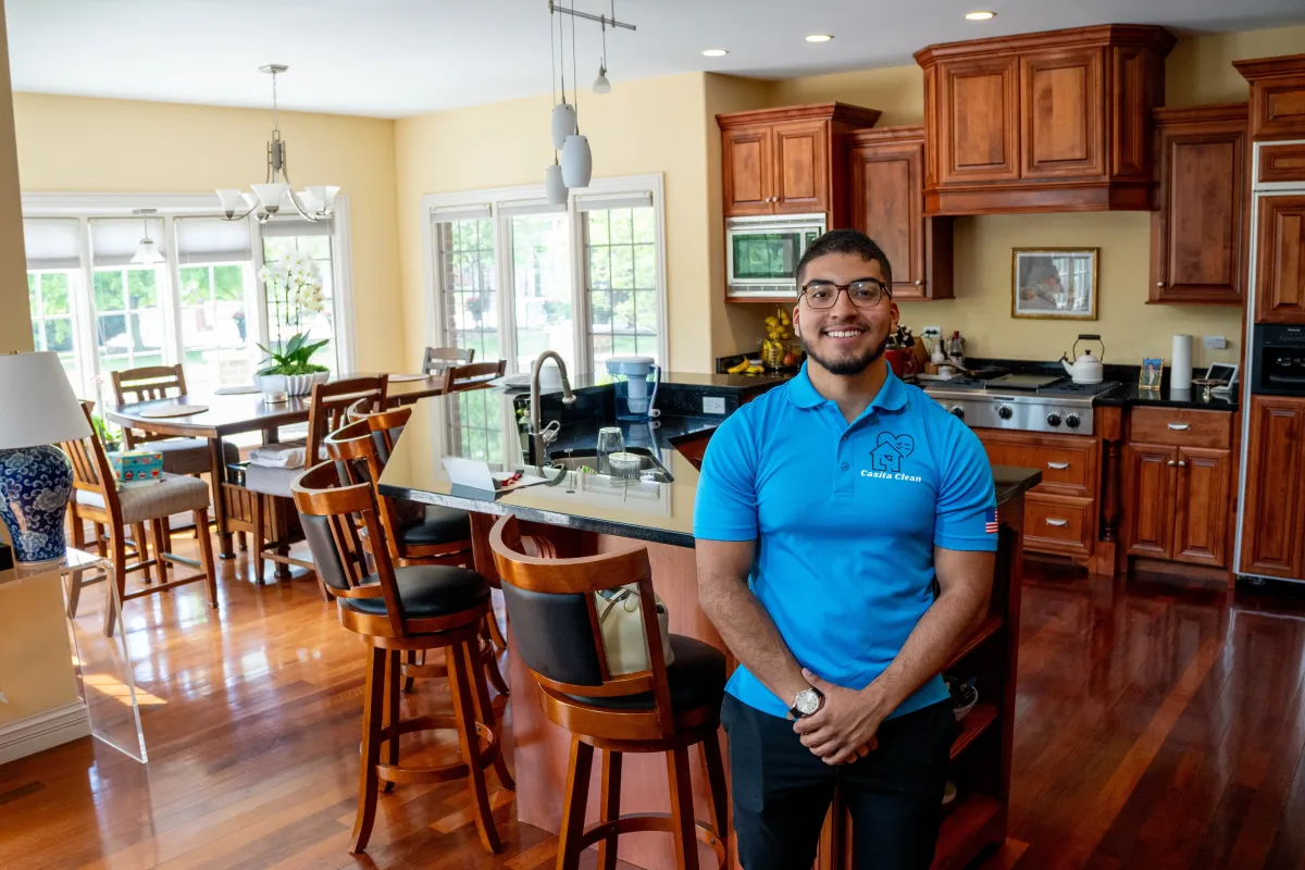 Owner of Casita Clean, Carlos Casita, and a cleaner in a freshly cleaned kitchen in Plainfield, IL