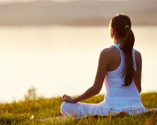 Person visualizing success and repeating positive affirmations to harness the power of autosuggestion