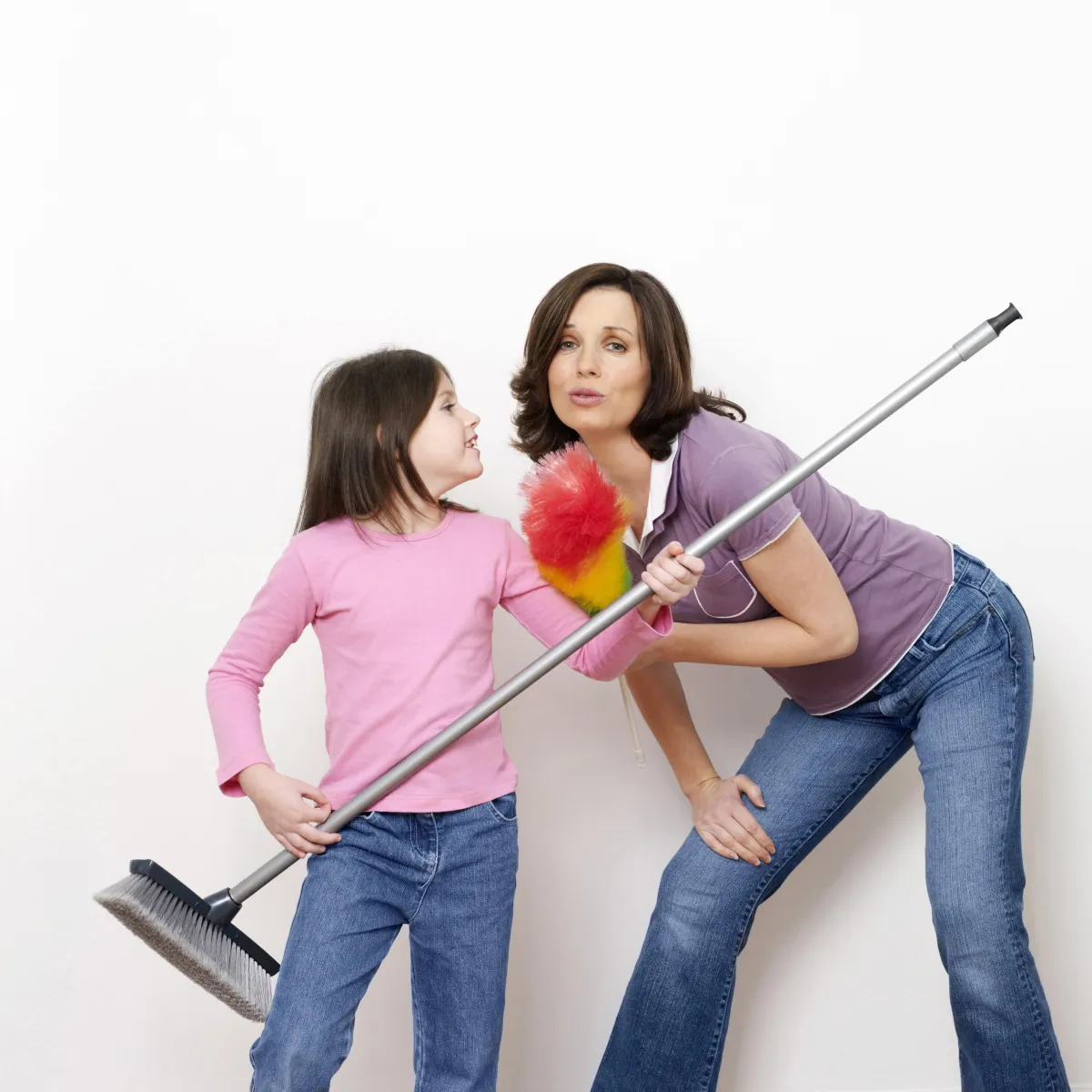 mom and daughter having fun cleaning