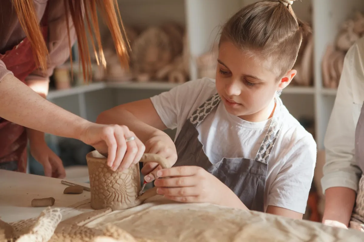 teen girl making a mug